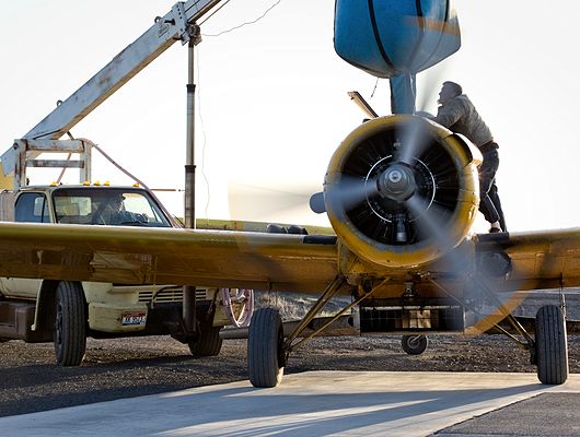 Small plane with boom truck