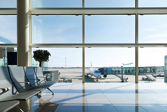 Airport waiting room with view of planes taking off