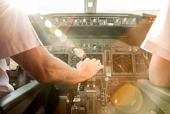 Two pilots in the pit of an airplane